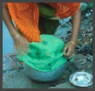 Straining with cloth small.jpg